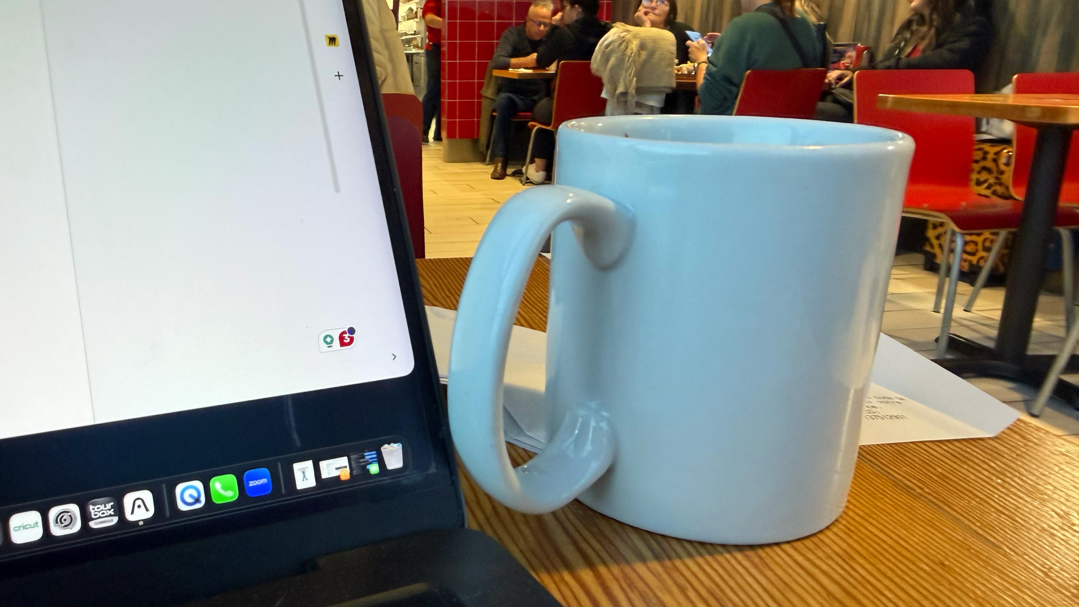 Fresh Coffee — I could switch tables, I guess, but that just makes things awkward, and there's no guarantee the next one won't wobble. Better to stick with the known quantity and let the coffee clean the grout.